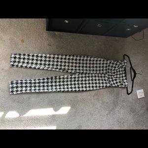 black and white checkered FashionNova jumpsuit.